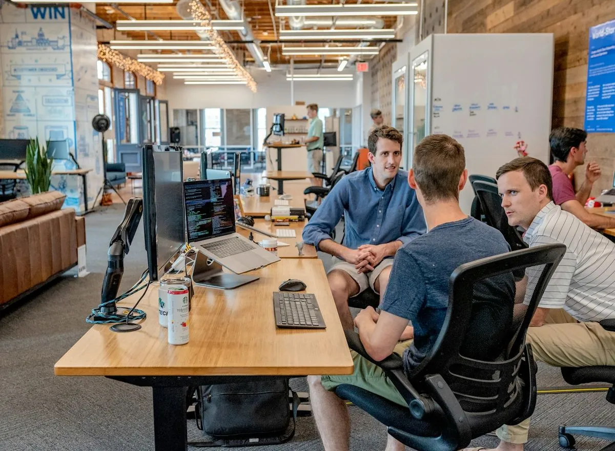 Software team reviewing work together in their studio.